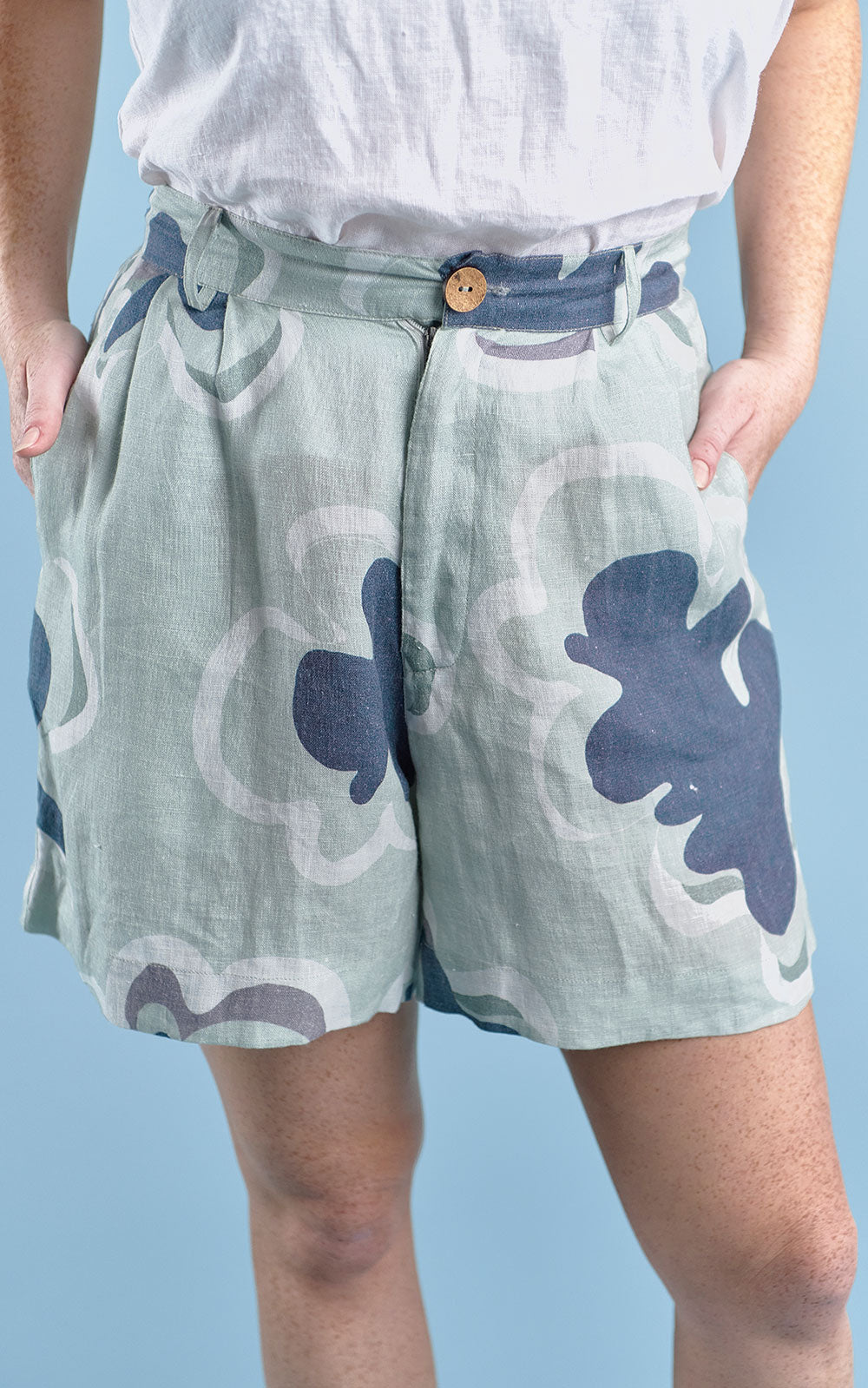 three quarter length tailored linen shorts in navy and seamist print gidget