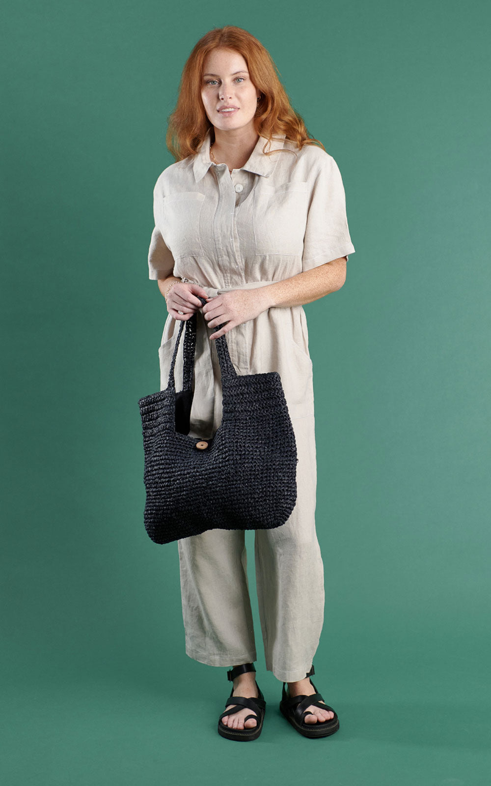 boiler suit in black linen with contrast stitching