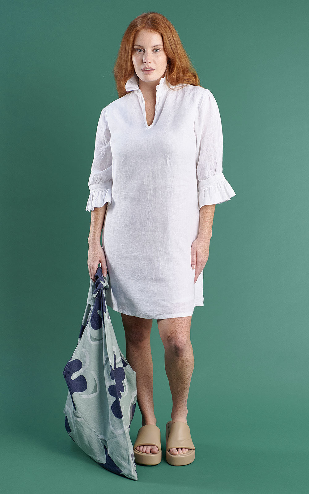 white linen mini dress with high neck frill and sleeves