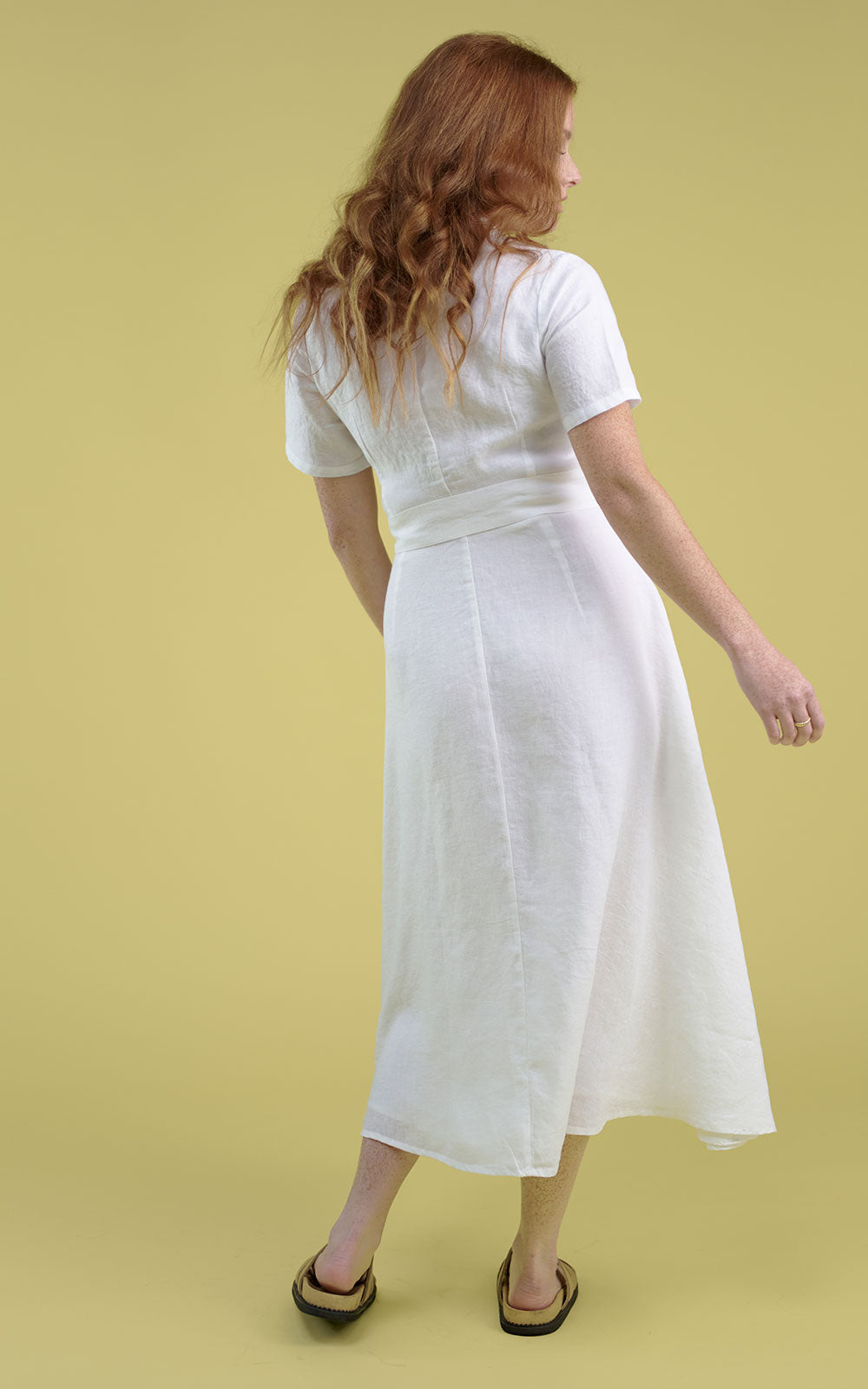 white linen maxi dress with v neck and middle leg split including tie belt