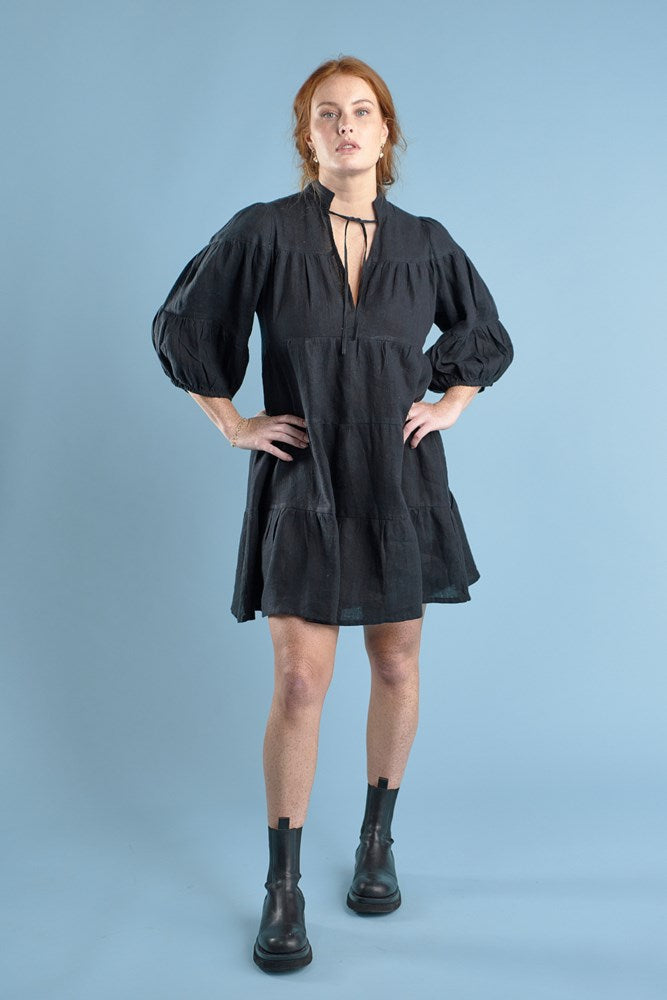 tiered mini dress with tie up neck in black