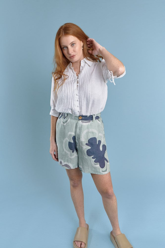 three quarter length tailored linen shorts in navy and seamist print gidget