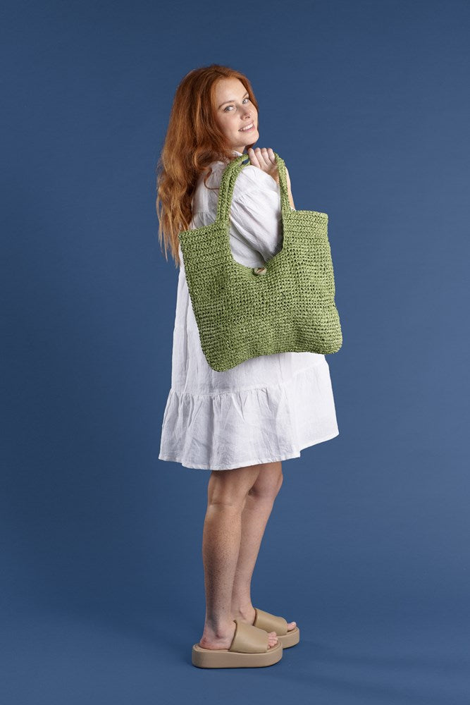 beach bag with button enclosure and cotton lining green