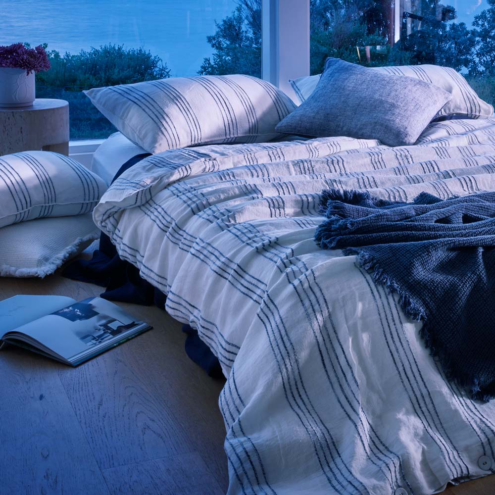 rockpool linen quilt cover and linen pillow cases in white with navy stripe