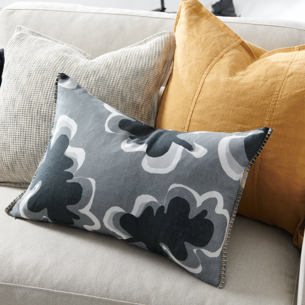 black, grey and white fun patterned linen cushion with contrast stitching feature