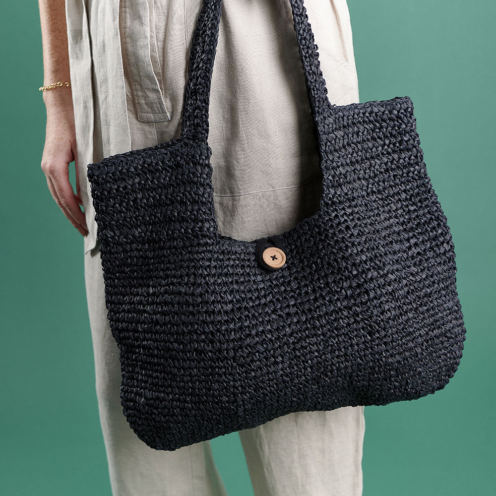 beach bag with button enclosure and cotton lining black