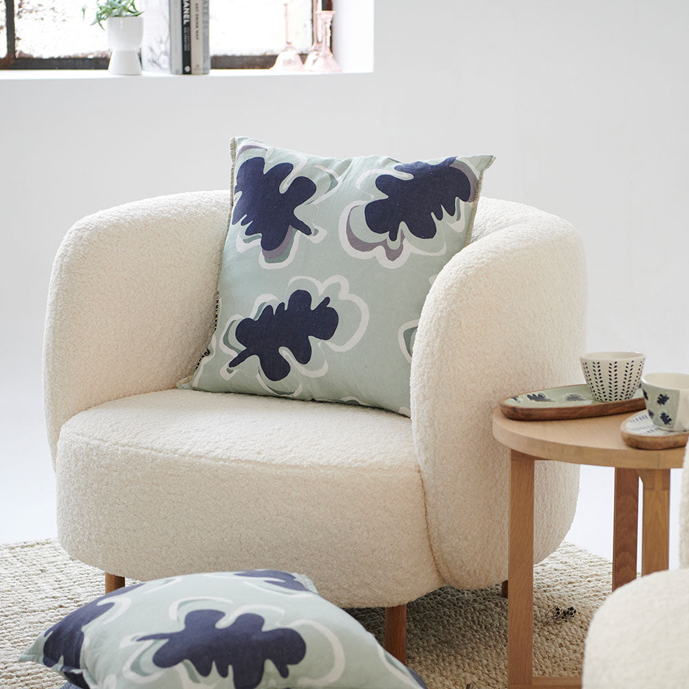 100% linen cushion in a sea mist and navy leaf abstract pattern and a contrast stitch feature100% linen cushion in a sea mist and navy leaf abstract pattern and a contrast stitch feature