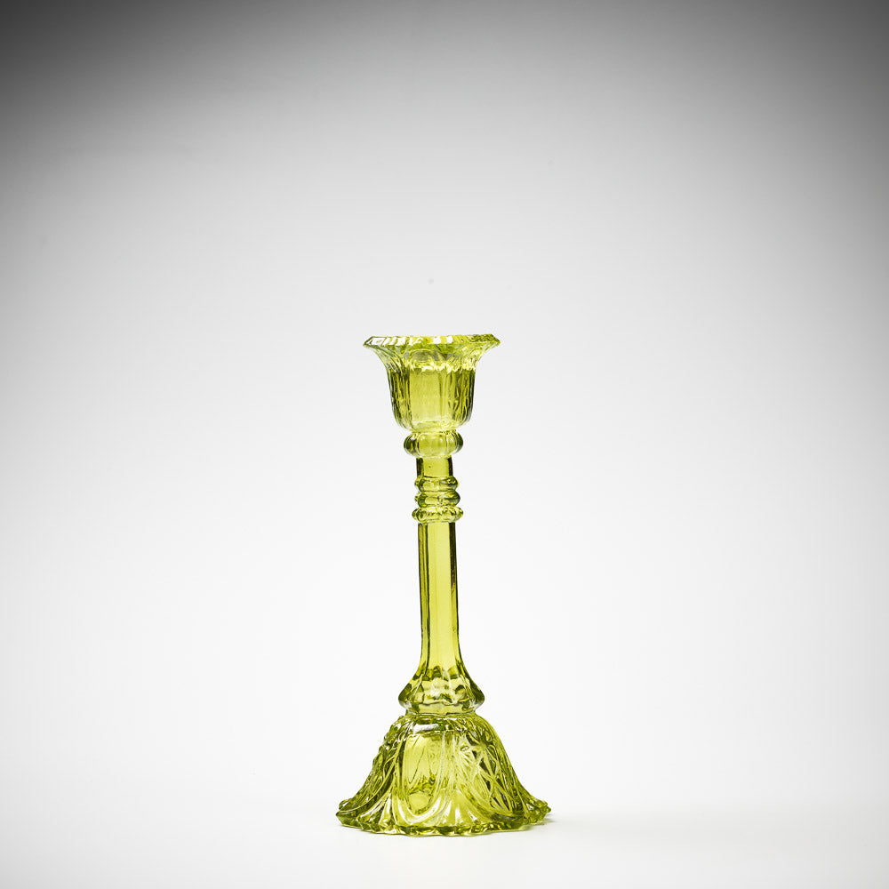 glass candlestick holders in multiple sizes in green