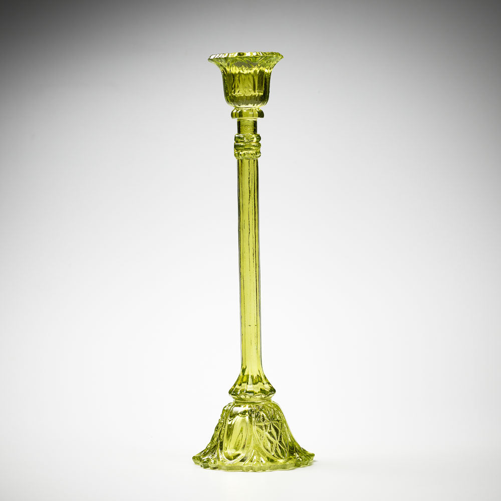 glass candlestick holders in multiple sizes in green