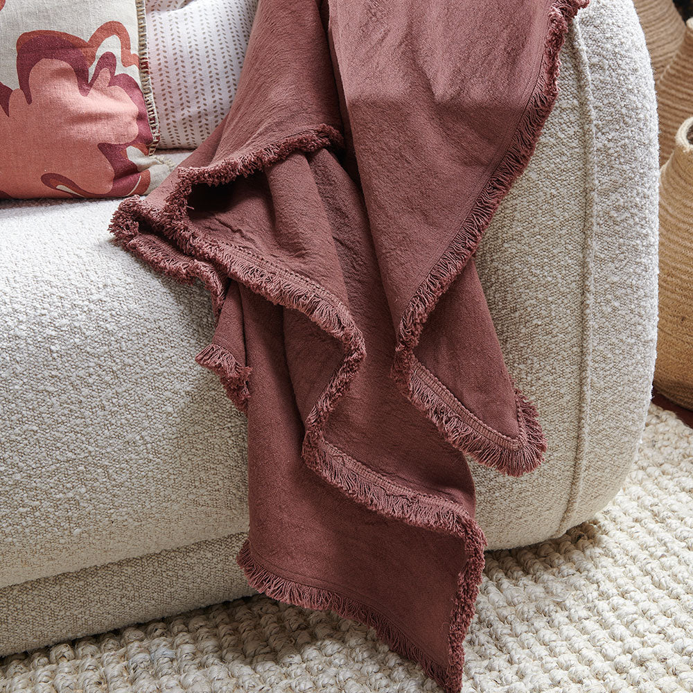 100% linen throw with fringe edge feature in desert rose a pink colour