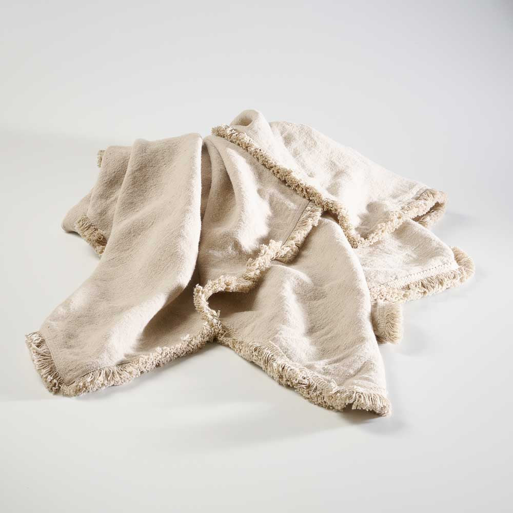 100% linen throw with fringe edge feature in natural