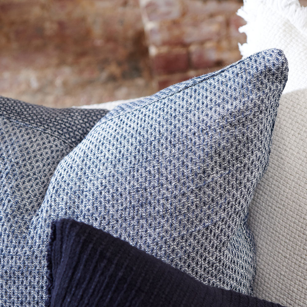 reversible diamond pattern linen cushion in a navy blue