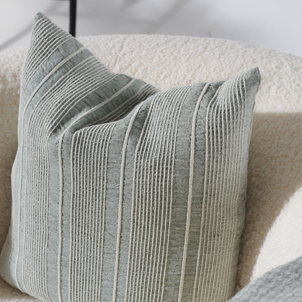 pistachio linen cushion with a white stripe feature