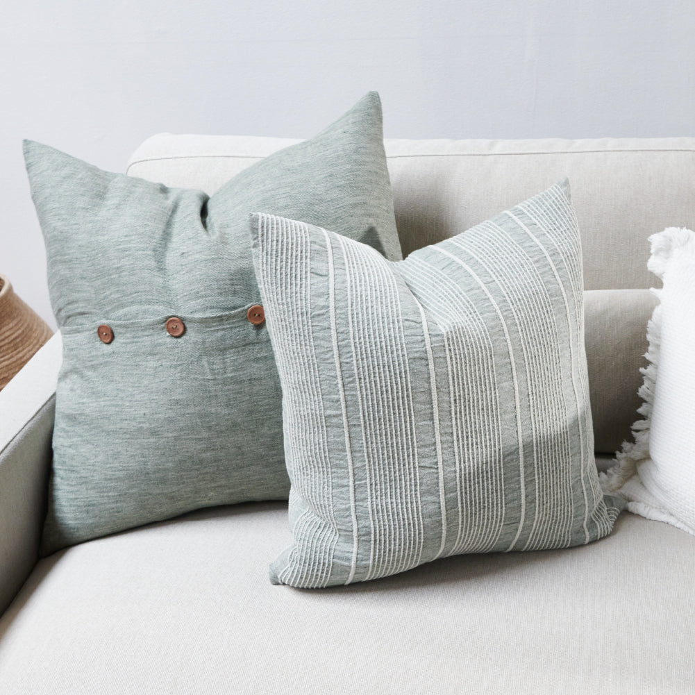 pistachio linen cushion with a white stripe feature