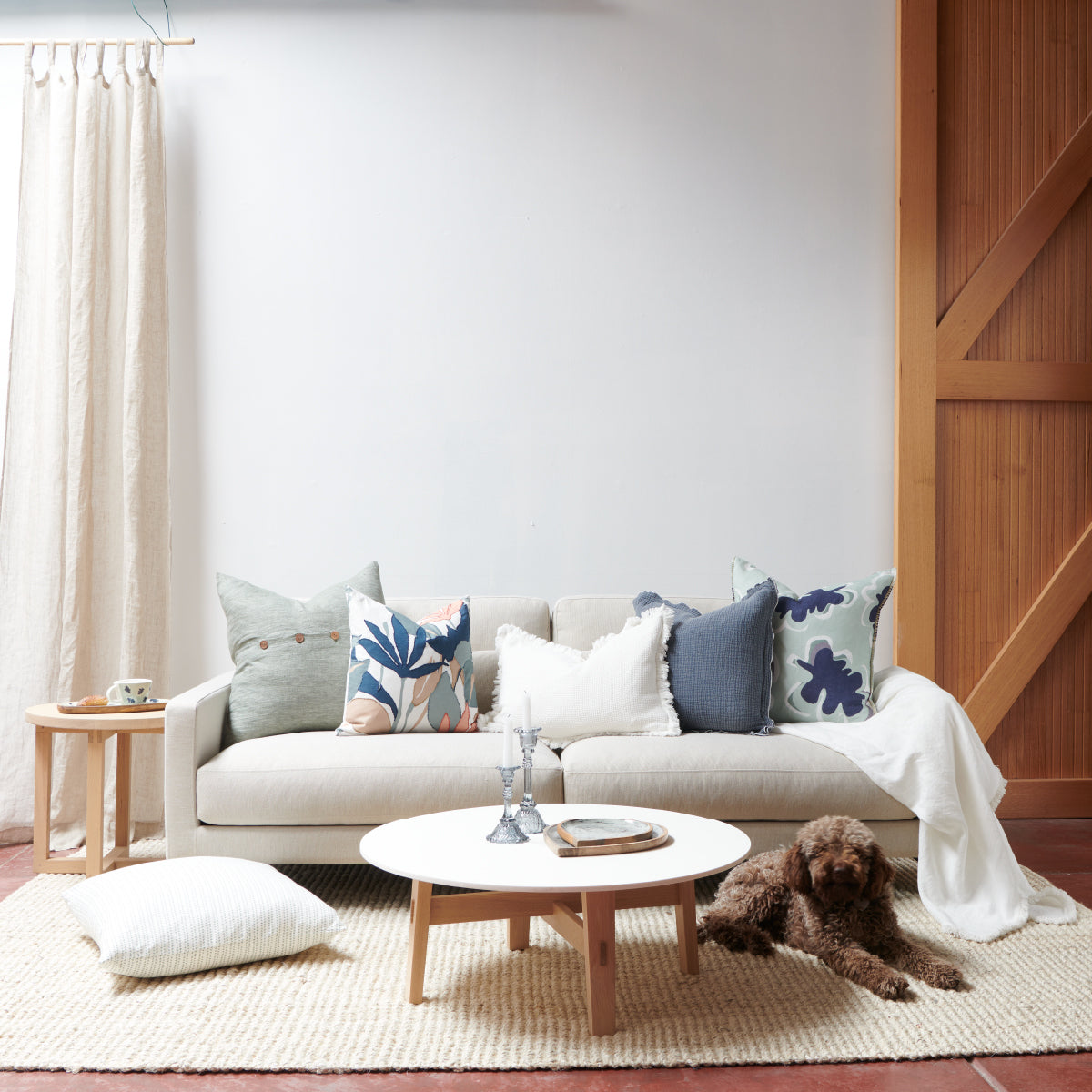 steel blue coloured cushion in a soft fabric with a double flange design and contrast stitching detail