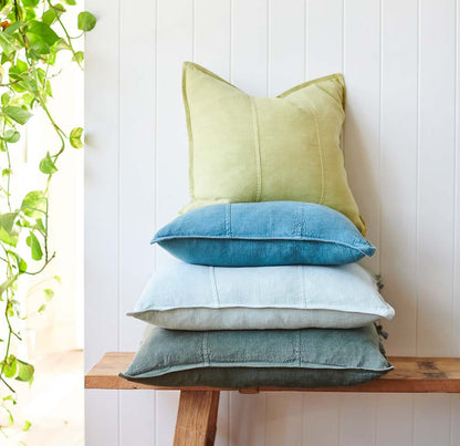 Luca Linen cushions stacked on a bench seat