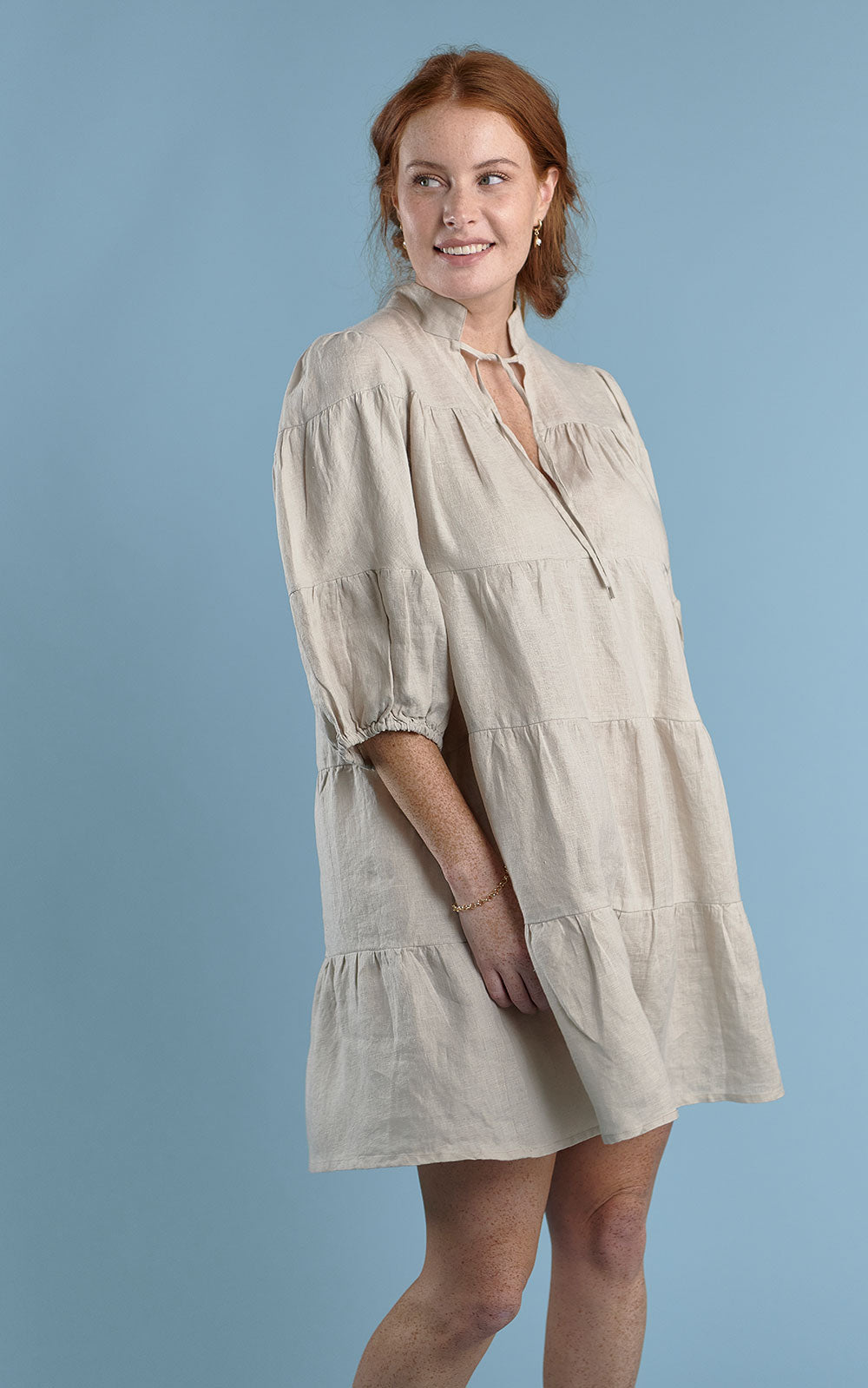 tiered mini dress with tie up neck in natural