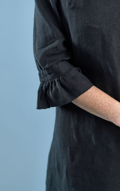 black linen mini dress with high neck frill and sleeves