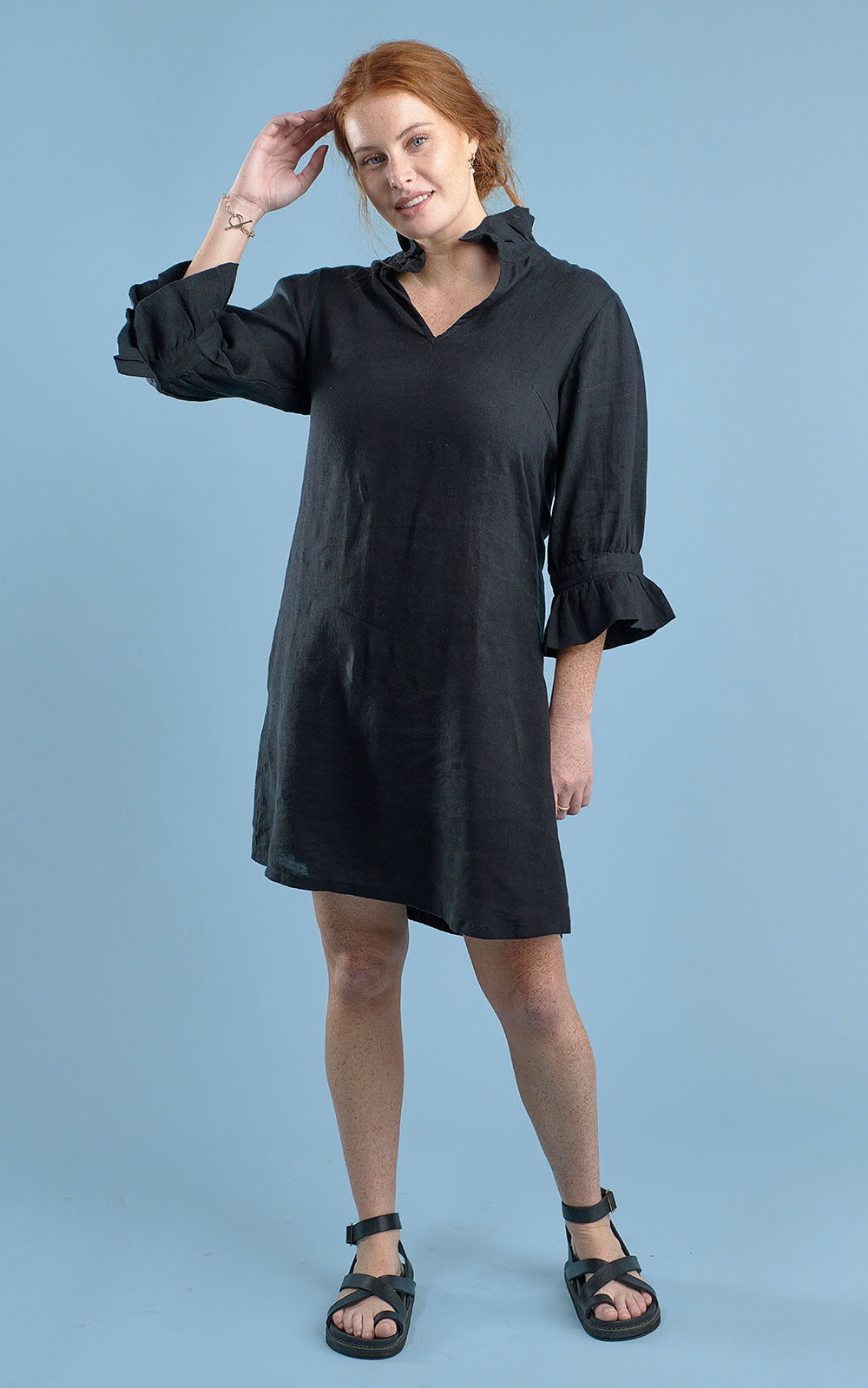 black linen mini dress with high neck frill and sleeves