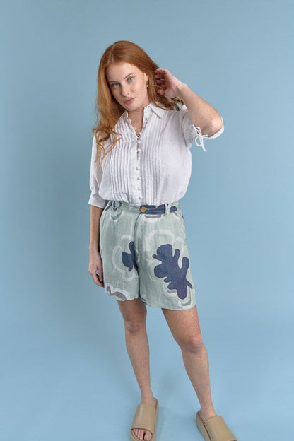 three quarter length tailored linen shorts in navy and seamist print gidget