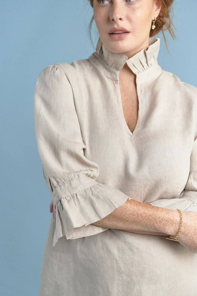 natural linen mini dress with high neck frill and sleeves