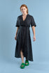 black linen maxi dress with v neck and middle leg split including tie belt