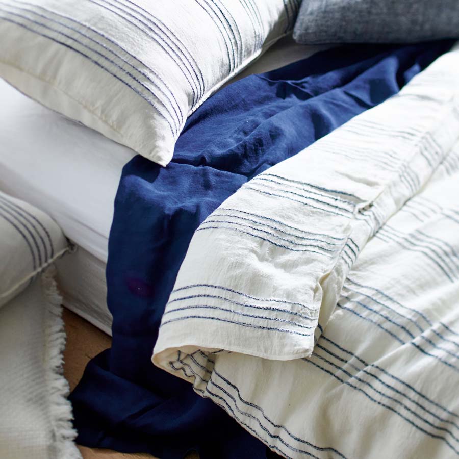 rockpool linen quilt cover and linen pillow cases in white with navy stripe