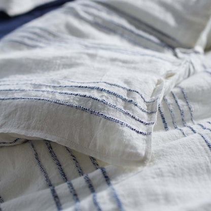 rockpool linen quilt cover and linen pillow cases in white with navy stripe