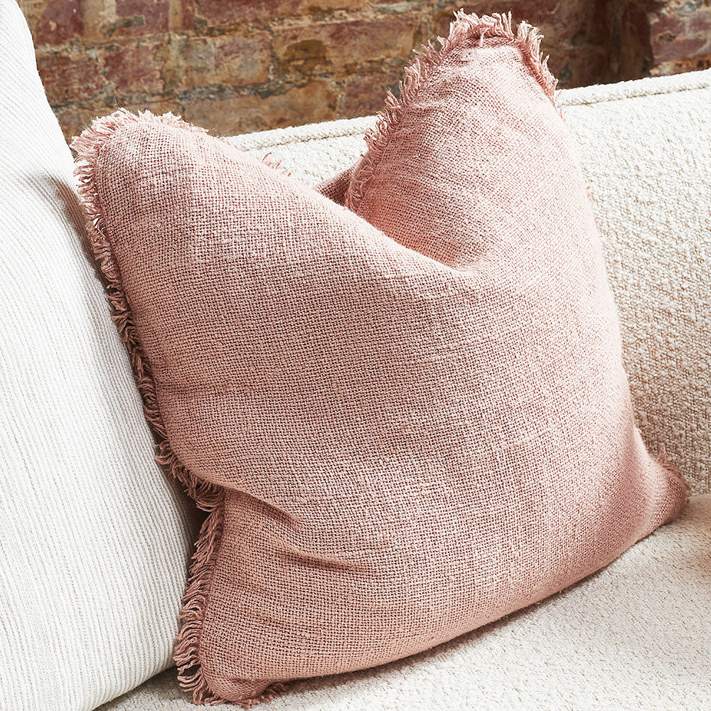 hand woven linen cushion in musk pink with fringing