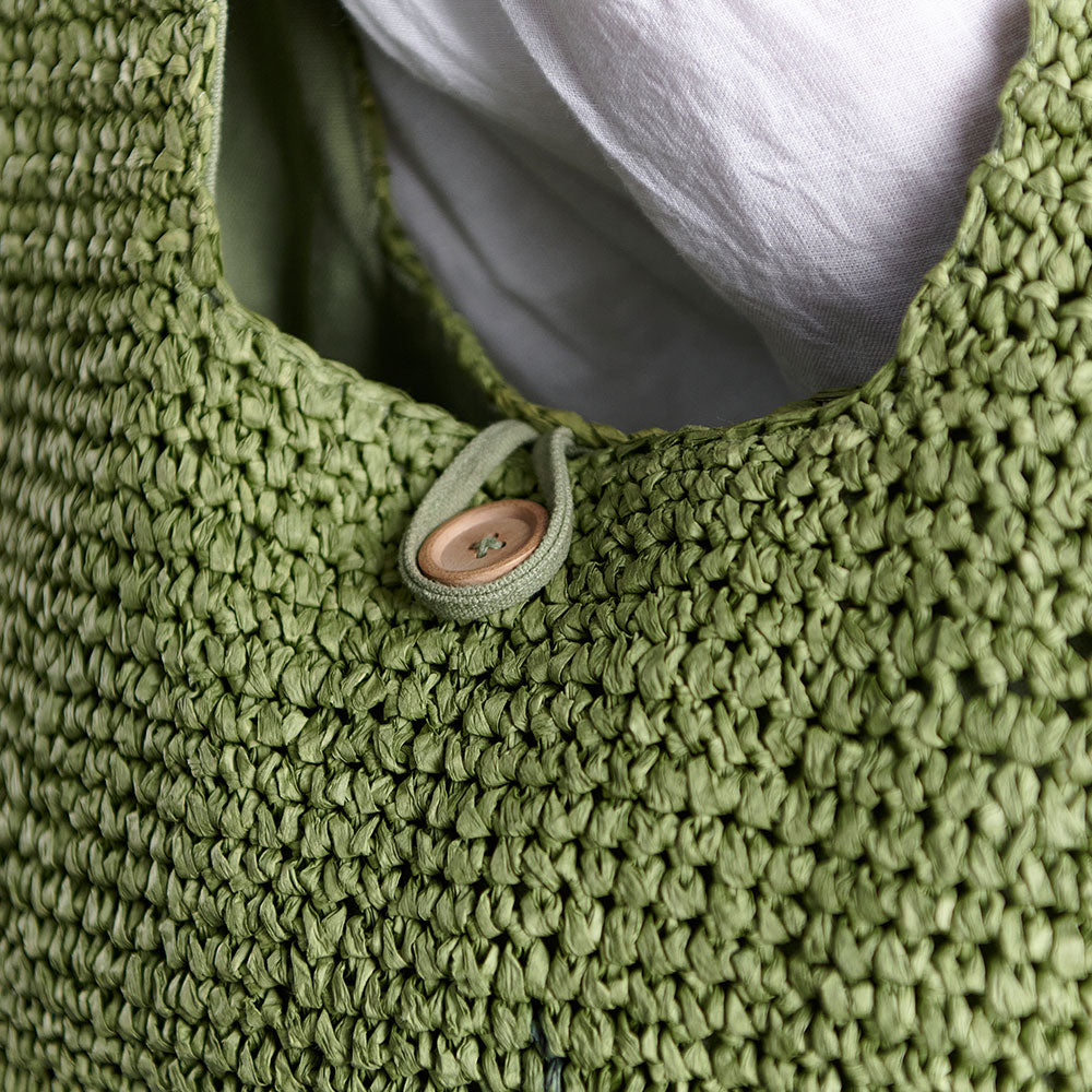 beach bag with button enclosure and cotton lining green