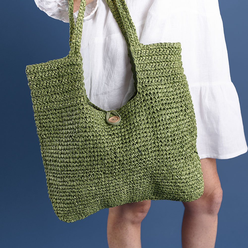 beach bag with button enclosure and cotton lining green