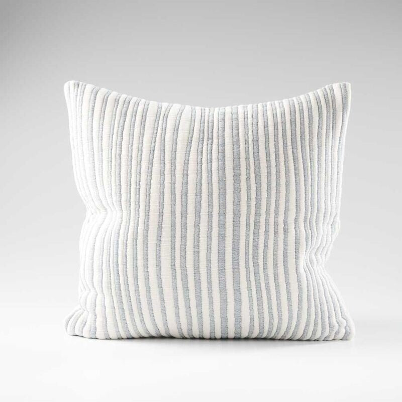 blue and white stripped cushion in a soft ribbed material
