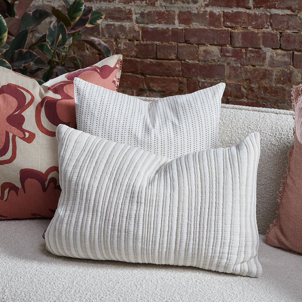 natural and white stripped cushion in a soft ribbed material