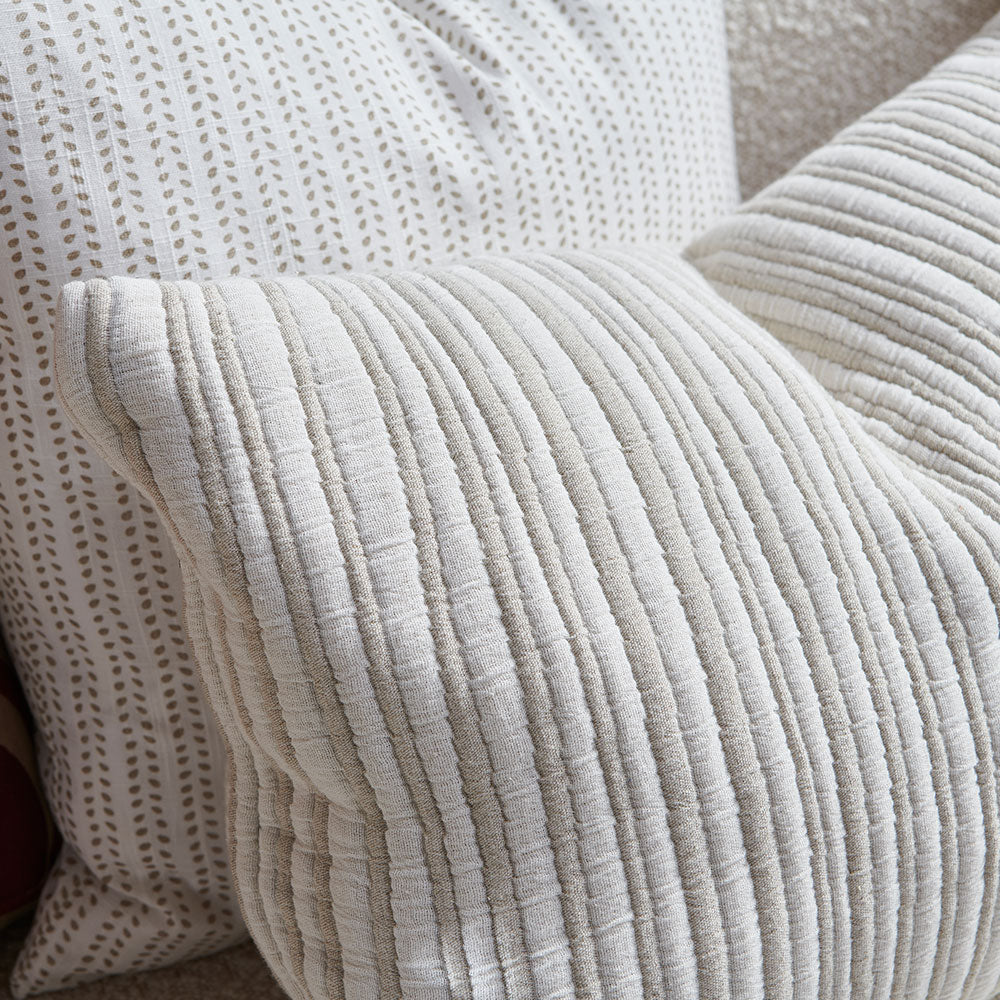 natural and white stripped cushion in a soft ribbed material