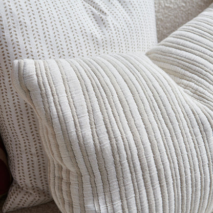 natural and white stripped cushion in a soft ribbed material