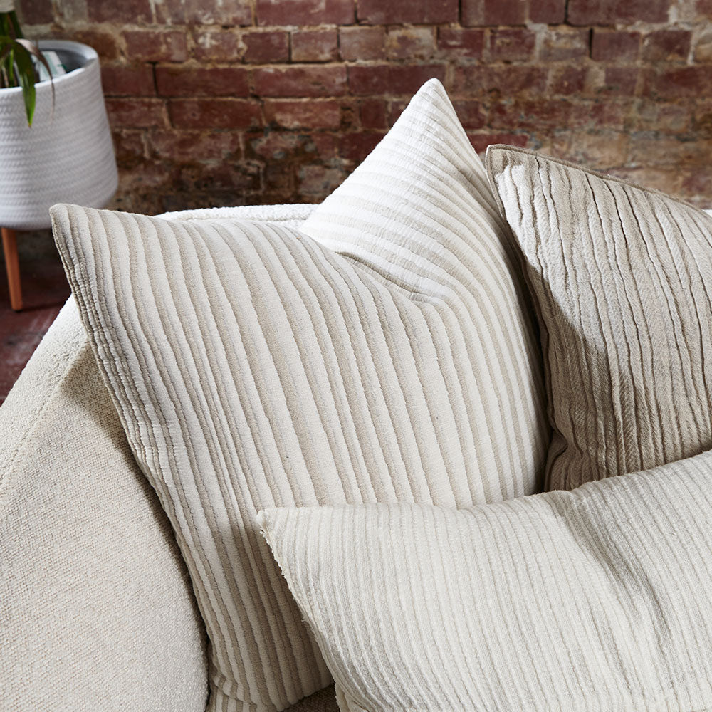 natural and white stripped cushion in a soft ribbed material