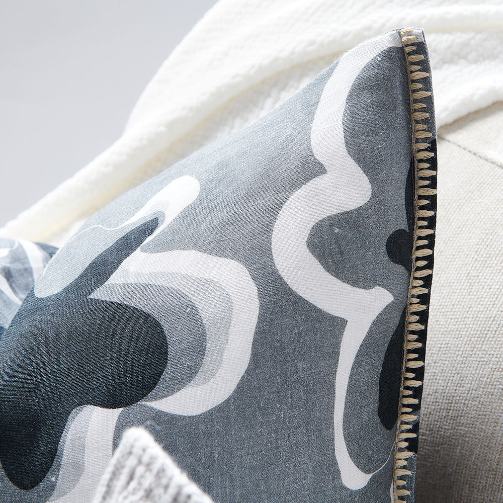 black, grey and white fun patterned linen cushion with contrast stitching feature