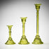 glass candlestick holders in multiple sizes in green