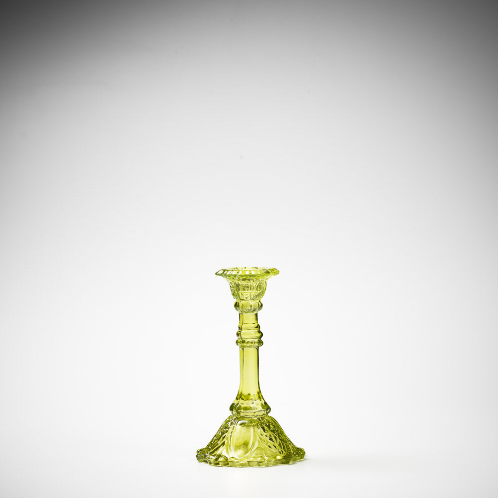 glass candlestick holders in multiple sizes in green