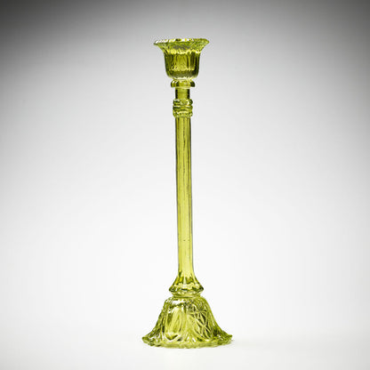 glass candlestick holders in multiple sizes in green