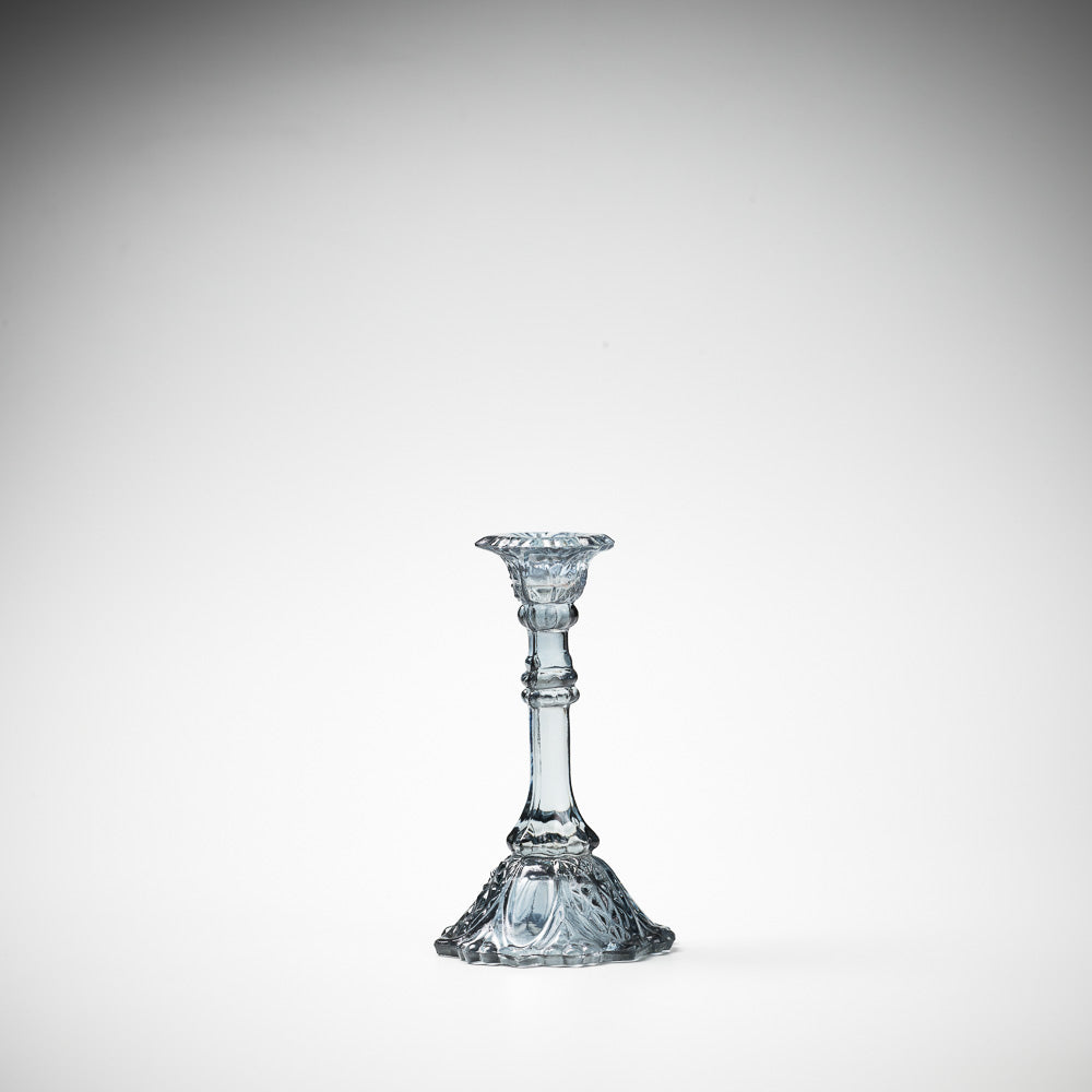 glass candlestick holders in multiple sizes in grey