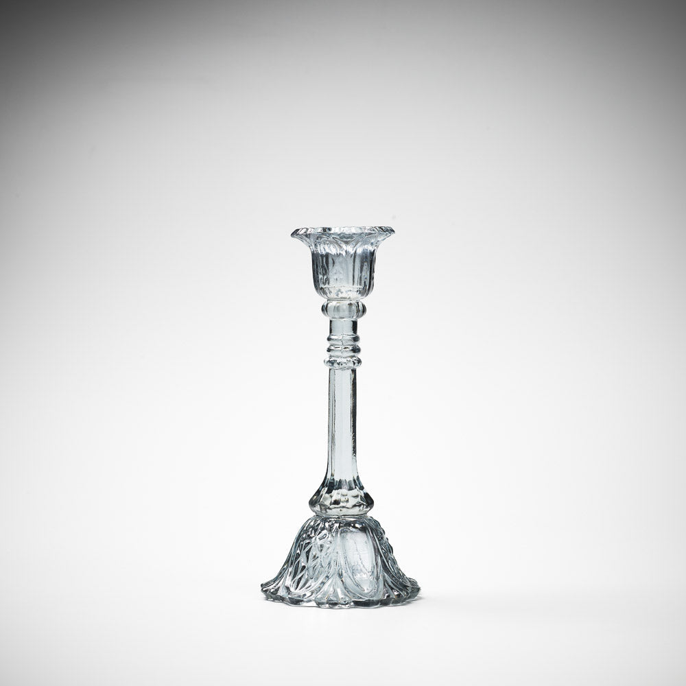 glass candlestick holders in multiple sizes in grey