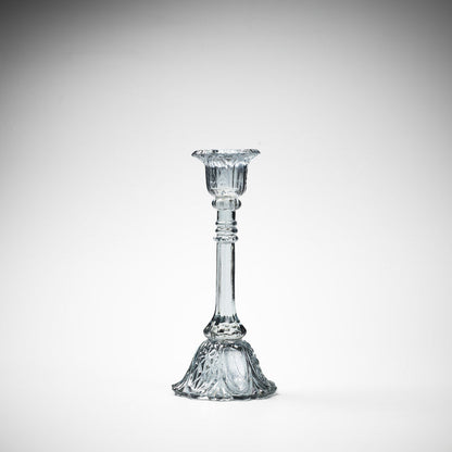 glass candlestick holders in multiple sizes in grey