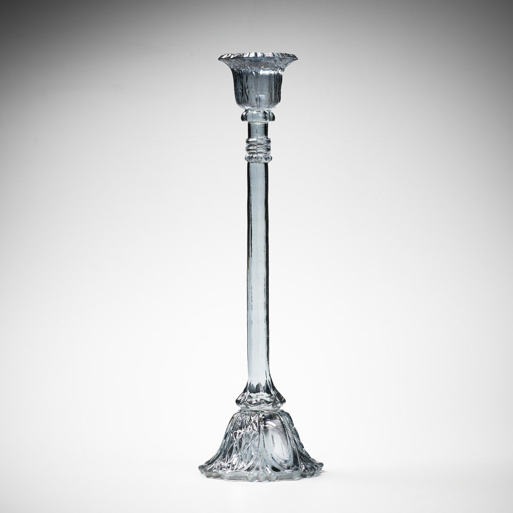 glass candlestick holders in multiple sizes in grey