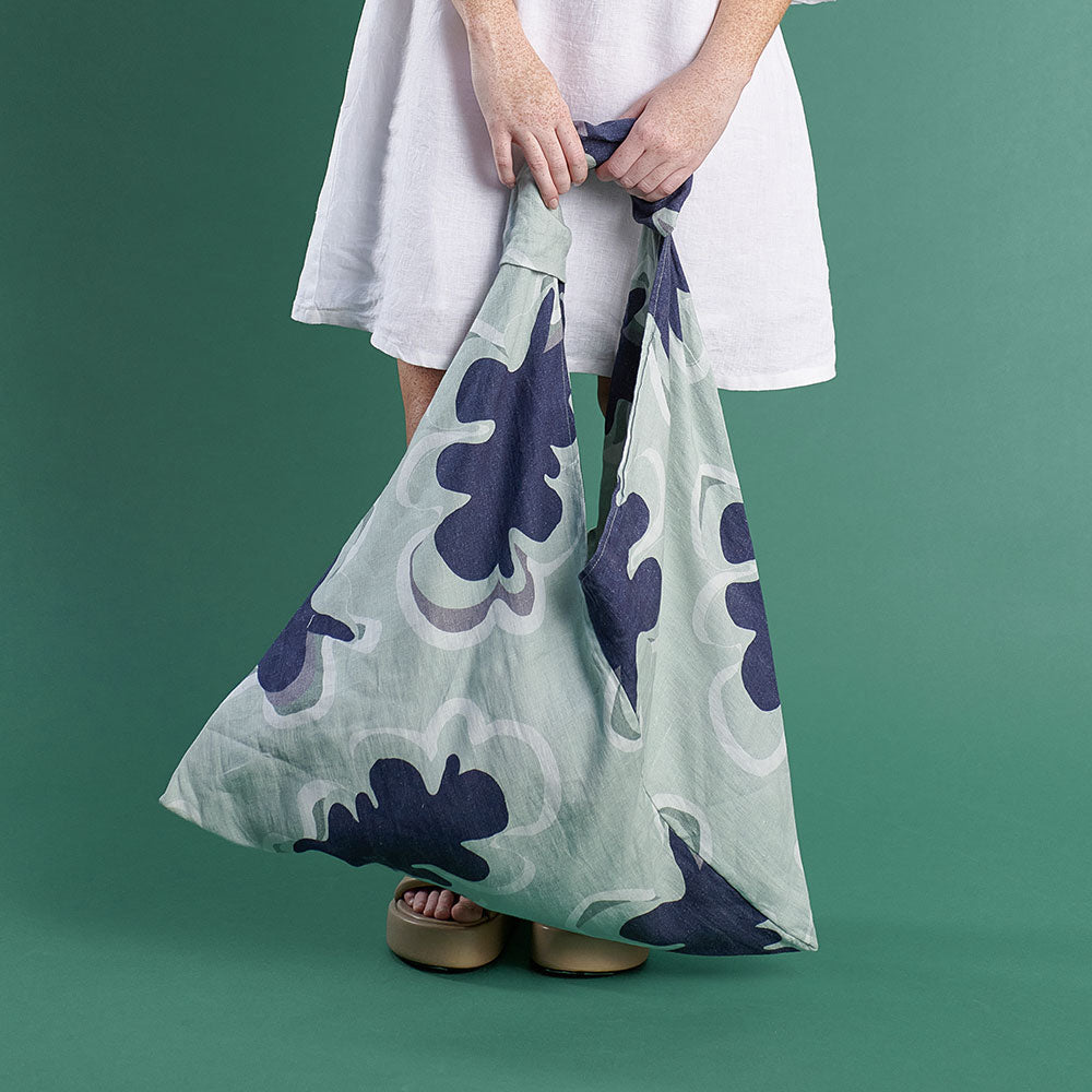 large linen beach bag in navy and seamist print gidget