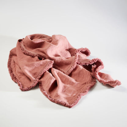 100% linen throw with fringe edge feature in desert rose a pink colour
