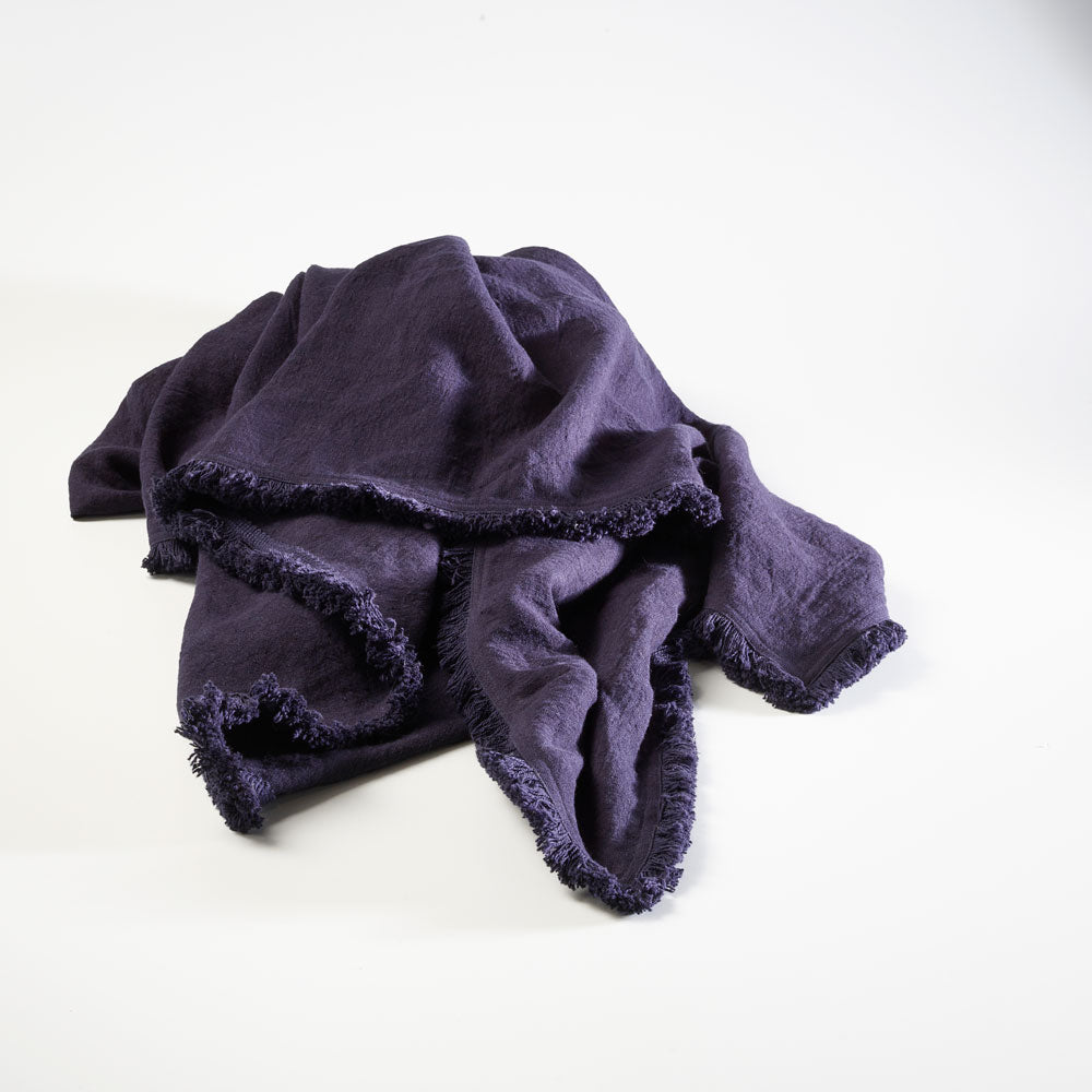 100% linen throw with fringe edge feature in navy blue
