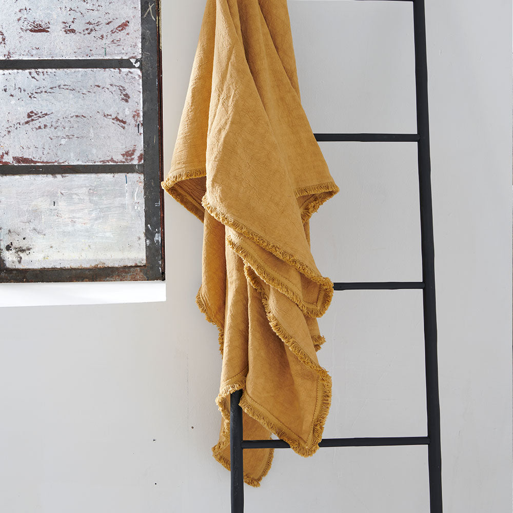 100% linen throw with fringe edge feature in turmeric, golden yellow colour
