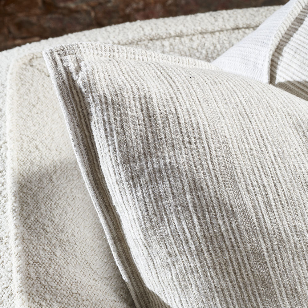 100% linen cushion in a natural and white faint stripe pattern which is reversible