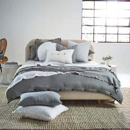 pistachio coloured duvet set with contrast stitching, lettuce edge and wooden button feature